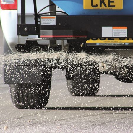 White-winter-gritting-salt-being-spread